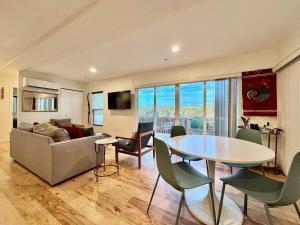 a living room with a table and a couch at Unique Container, Home 20 Acres, Modern Stay in Kelsey