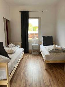 Ένα ή περισσότερα κρεβάτια σε δωμάτιο στο Central and Spacious Apartment for 8