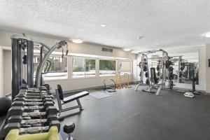 a gym with two treadmills and two tread machines at Walk to Old Town - 1BR Condo, Heated Pool and Patio in Scottsdale