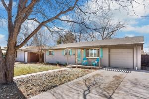 a house with two blue chairs in front of it at The New Cherry Creek Retreat. 4BR. Large Back Yard in Glendale