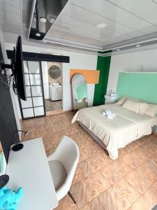 Postel nebo postele na pokoji v ubytování Recuerdo Verde