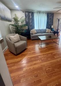 a living room with a couch and a coffee table at Family Comfort with Graceful Stays in Decatur