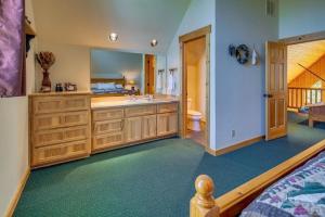 a bathroom with a sink and a toilet in a room at Forest Ridge home in Redmond