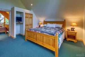 a bedroom with a large bed and two night stands at Forest Ridge home in Redmond