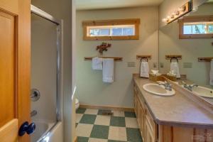 a bathroom with a sink and a shower and a mirror at Forest Ridge home in Redmond +42 photos