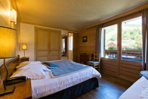 Postel nebo postele na pokoji v ubytování Hôtel La Montagne