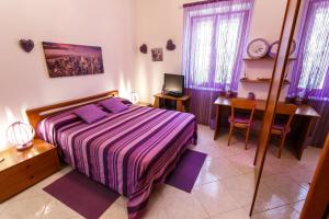 Postel nebo postele na pokoji v ubytování L'Aurora Viola