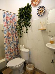a bathroom with a toilet and a sink at MejorClub in Valle de Anton +76 photos