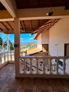 a view from the balcony of a house at Chalés São Francisco II in Santo Antônio do Pinhal