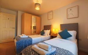 Ένα ή περισσότερα κρεβάτια σε δωμάτιο στο Roomy Spark Home with Parking, Garden, Wi-Fi