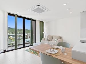 a dining room with a table and a couch at The Hills Residence at Simpson Bay in Simpson Bay