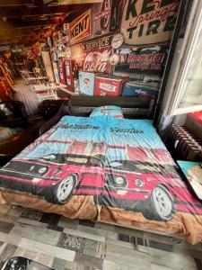 a bedroom with a bed with a car on it at König Apartment in Kynšperk nad Ohří