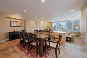 a kitchen and dining room with a table and chairs at Presidio Park home in Redmond +32 photos