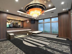 a large lobby with a large chandelier at APA Hotel Sagamihara Hashimoto Eki Higashi in Sagamihara
