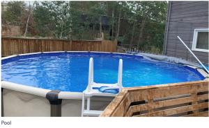 a pool with two chairs sitting in it at Northern Haven Properties in Yellowknife