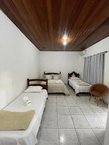 Giường trong phòng chung tại Pousada Predileta
