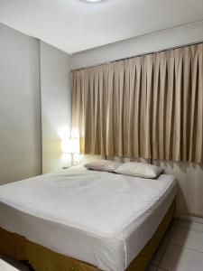 Voodi või voodid majutusasutuse Oásis Termal Flat Top Exclusivo Em Caldas Novas toas