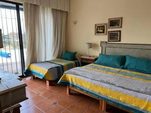 Ένα ή περισσότερα κρεβάτια σε δωμάτιο στο Villa Las Garzas +27 φωτογραφίες