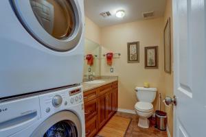 a bathroom with a washer and dryer in it at Northern Lights home in White Salmon