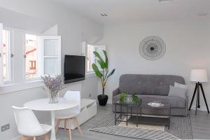 Televízia a/alebo spoločenská miestnosť v ubytovaní iloftmalaga Studio Apartments