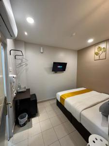 a hospital room with a bed and a tv at SS Grey Hotel BBKL in Kuala Lumpur +32 photos