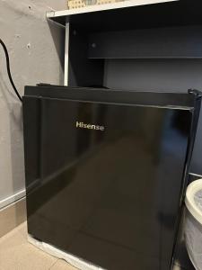 a black hitech computer monitor sitting on the floor at SS Grey Hotel BBKL in Kuala Lumpur
