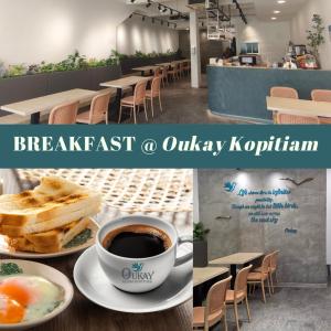Una mesa con una taza de café y un plato de comida. en Okid Hotel, en Johor Bahru