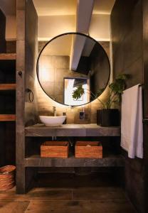 a bathroom with a sink and a mirror at Bonito departamento en Avandaro in Valle de Bravo