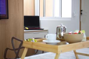 Et tv og/eller underholdning på Janelas do Rio - Apartamento 2 quartos com vista para o Rio, Wi-Fi, ar-condicionado e máquina lava e seca