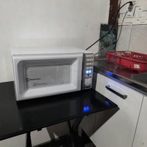 Η κουζίνα ή μικρή κουζίνα στο Suites Joao e Maria Quarto 04