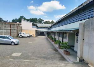 an empty parking lot in front of a building at Modern Guest House 2BR in Nakuru