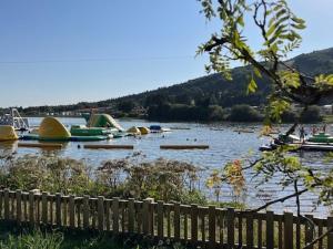 a body of water with boats in it at Studio moderne à Super Besse, vue lac des Hermines - FR-1-814-136 in Super Besse