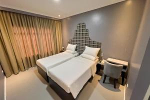 Ένα ή περισσότερα κρεβάτια σε δωμάτιο στο B Hotels Angeles City