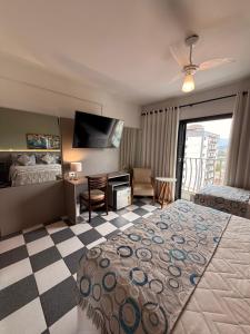 Katil atau katil-katil dalam bilik di Hotel Ze Maria Cambui