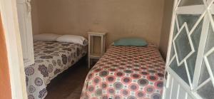 Kleines Zimmer mit 2 Betten in der Unterkunft El Jacalito in Matehuala