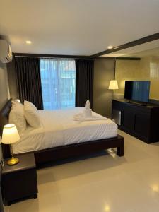 Postel nebo postele na pokoji v ubytování Kooters Guesthouse Bali