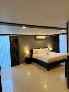 Postel nebo postele na pokoji v ubytování Kooters Guesthouse Bali + 1 fotografie