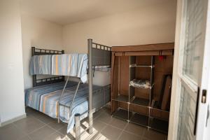 a small room with two bunk beds in it at Family Home with Pool, El Mirador 2 Bedrooms in Tlayecac +27 photos