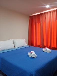 Giường trong phòng chung tại Departamento DON ALBERTO