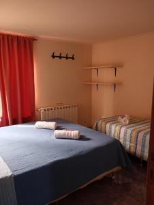 Giường trong phòng chung tại Departamento DON ALBERTO +10 ảnh