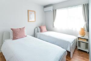 Postel nebo postele na pokoji v ubytování みらいステイ横手