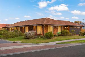 a house on the side of a street at Family Oasis near Watergardens Parking in Sydenham