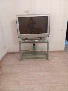 a television sitting on a table in a room at Ботанічний Сад in Kharkiv