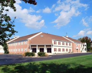 a large brick school building with a green lawn at Rodeway Inn & Suites Myerstown - Lebanon in Myerstown