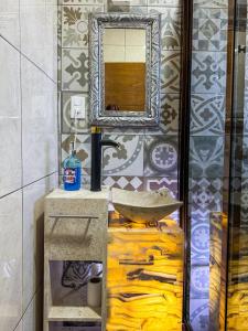 a bathroom with a sink and a mirror at Casa Sac Nicte Tlalpujahua in Tlalpujahua de Rayón +18 photos