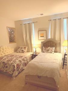 a bedroom with two beds and a window at Red sound retreat in Laurel