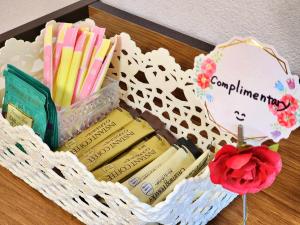 a basket filled with books on a table at ゲストハウスＰｉｋｏ in Shingu +41 photos