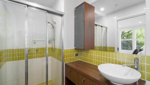 a bathroom with a sink and a shower at Absollut 2 in Mount Hotham +8 photos