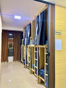 a row of bunk beds in a room at Nhật's Sapa Central Hostel in Sapa