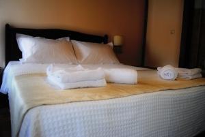 Postel nebo postele na pokoji v ubytování Chorostasi Mansion